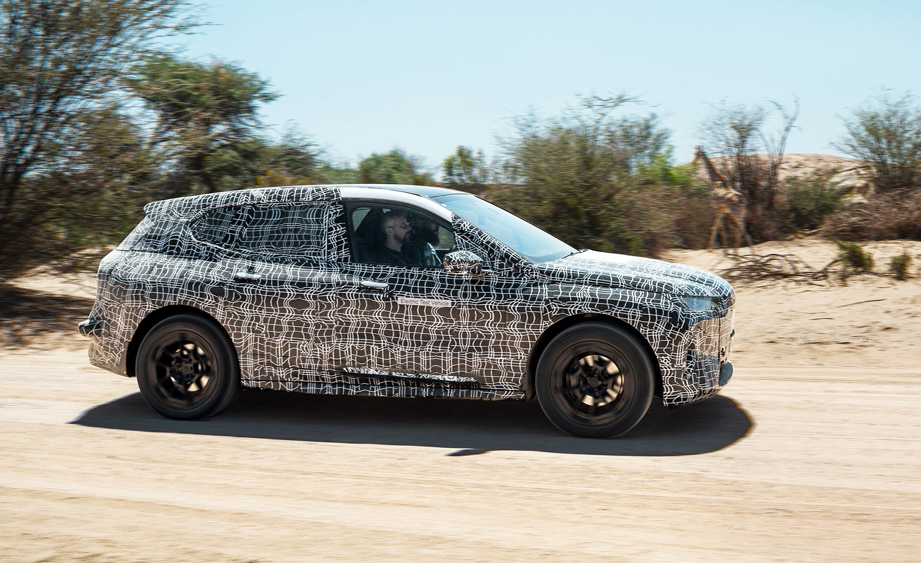 BMW's teases its iNext prototype EV during a hot-weather test